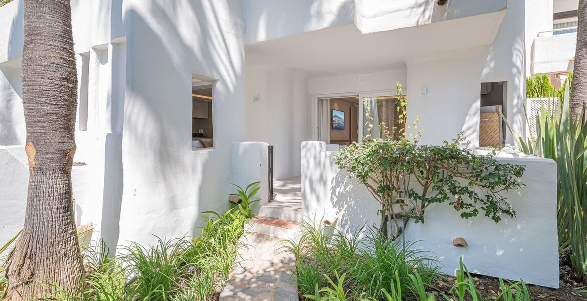 Un elegante apartamento de tres dormitorios en la planta baj